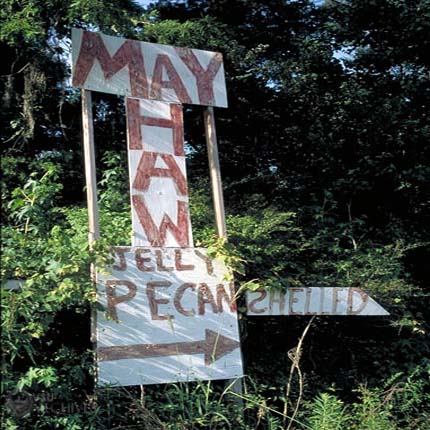 Roadside sign advertising Mayhaw Jelly.