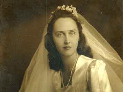 Leona Wedding Portrait, December 1945. Framed portrait photograph of Leona Strickland Hudson in her wedding dress. Married to Dugald Hudson December 28, 1945.