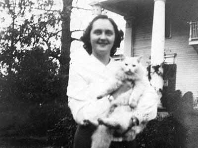 Leona and Mr. White (Late 1930s): A picture of Leona and a cat named Mr. White taken in the late 1930s.