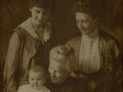 The baby is Leona Strickland, with her mother Rosa Hill Strickland, her grandmother Annie Lee Hill, and her great grandmother, in the middle, Rosaline McCann.