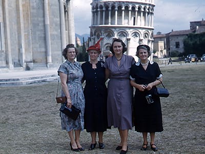 Sugar, Mrs. Stump, Leona, and Mamie in front of the Leaning Tower of Pisa.